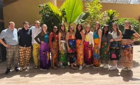 a group of students and faculty smiling